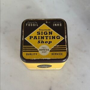 Fossil Yellow & Brown Sign Painting Shop Watch Tin
